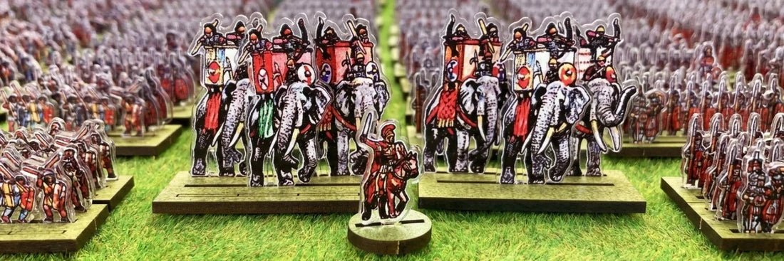 Tabletop miniature battle depicting the siege of Alesia with Gallic forces under Vercingetorix confronting Roman troops led by Julius Caesar