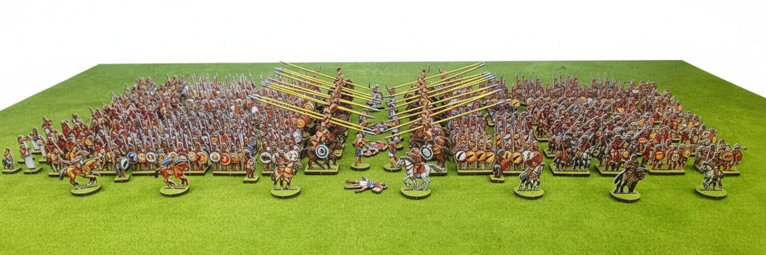 Miniature horsemen advancing in a cavalry charge formation across a battlefield in a dynamic tabletop wargaming scene.